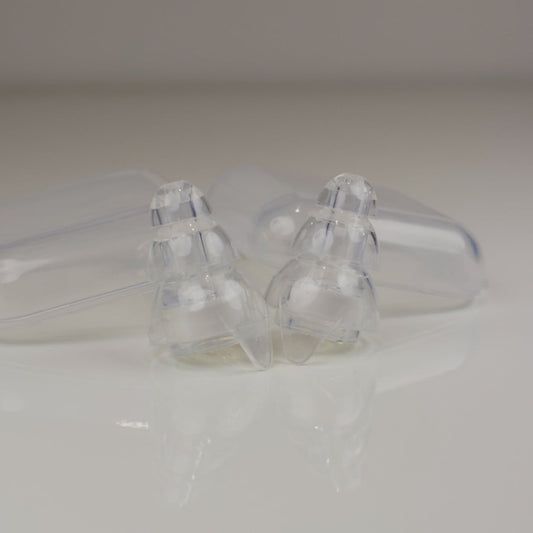 Clear plastic components on a white background